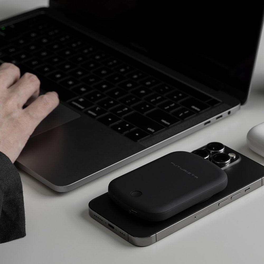 Pixy Go 5000mAh Thin MagSafe Wireless Power Bank attached on an iPhone 13